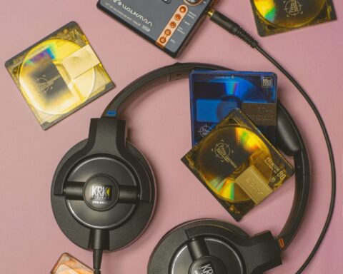 Headphones and a walkman on a pink background