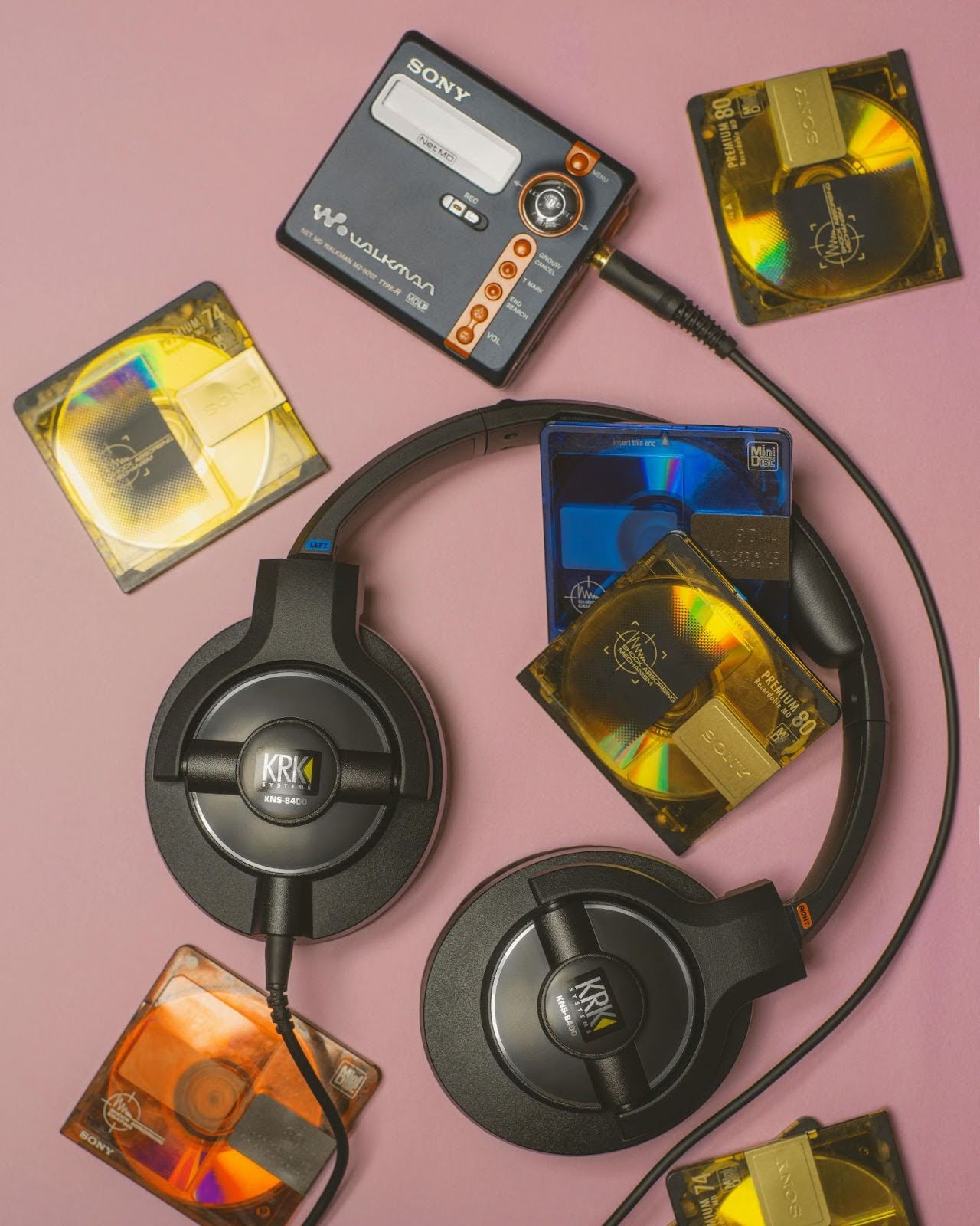 Headphones and a walkman on a pink background