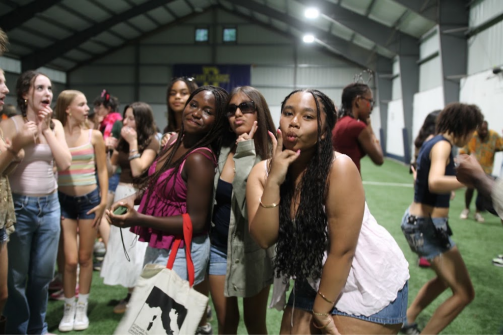Girls posing at a camp dance